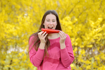 Fototapeta premium Beautiful attractive young woman holding healthy detox vegetable. Healthy lifestyle concept.