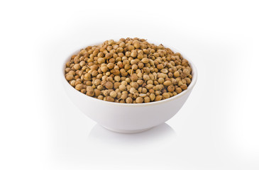 dried coriander seeds isolated on white background