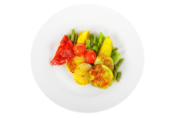 Vegetables grilled portion of side dish on a plate on white isolated background view from above. Appetizing dish for the menu restaurant, bar, cafe