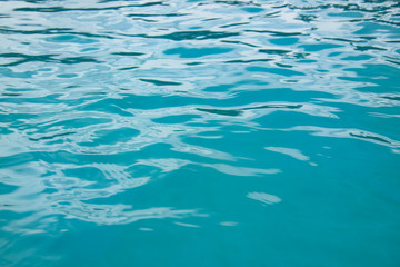 clear turquoise water with sun reflections