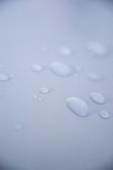 water drops on white surface