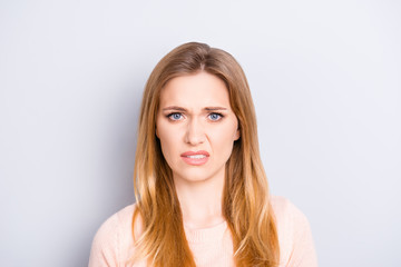 Close up portrait of funny confused puzzled unhappy upset sad uncertain unsure beautiful pretty...