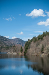 panorama of lake of Kruth with beautiful cloudy sky in alsace - France