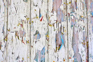 Wood board with faded and cracked paint, vintage background