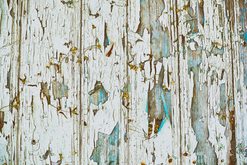 Wood board with faded and cracked paint, vintage background