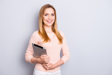 Portrait of excited cheerful joyful beautiful charming clever intelligent with toothy beaming smile marketer using digital tablet for her presentation isolated on gray background copy-space