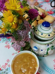 Honey, pies and flowers at the table
