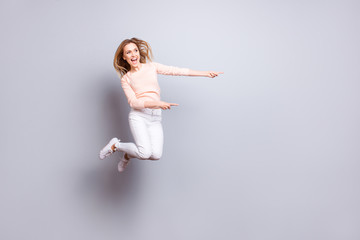 Fototapeta premium Choose choice look attention scream laugh entertainment people business person concept. Full-length full-size excited cheerful careless girl demonstrating empty place isolated on gray background