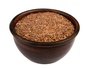 Flax seeds in ceramic bowl isolated on white background.