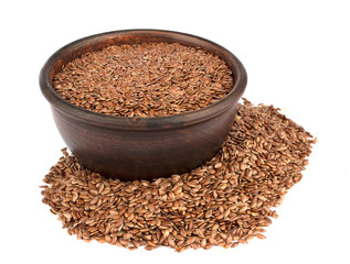 Flax seeds in ceramic bowl isolated on white background.