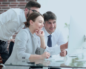 Business team discussing information sitting at the desk