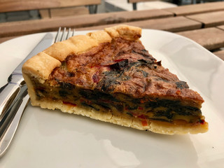 Turkish Food Quiche Tart Kis / Vegetable Pie Slice Served with Plate at Restaurant.