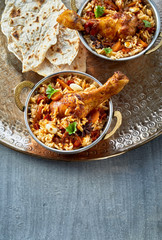 Bowls of spicy Arabian kabsa with Naan bread