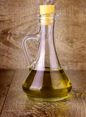 Extra virgin healthy Olive oil on wooden surface
