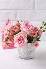 Bunch of tender pink roses flowers and decorative pink lantern