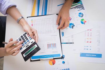 View from above.Business people meeting to analyze and discuss the situation on the financial report in meeting room. Meeting planning budget and cost.Business financial analysis and strategy concept.