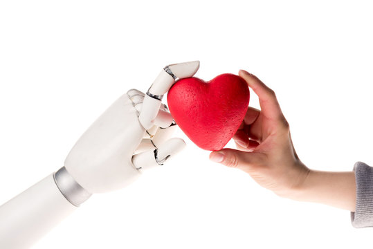 cropped image of robot and woman holding heart together isolated on white