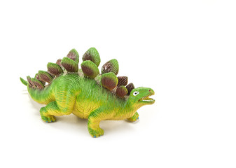 Dinosaur toy with open mouth on the white