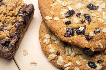 Oat cookie halves on wooden surface