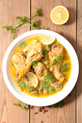 chicken leg cooked with olive, coriander and lemon