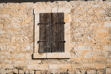 Stone building with old wooden shutter, Episkopi, Cyprus