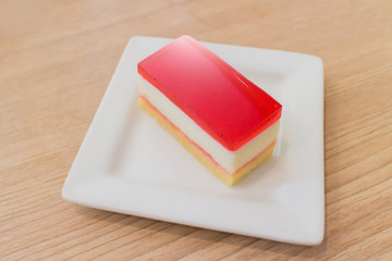 Fresh colorful strawberry jello cake, popular dessert dish