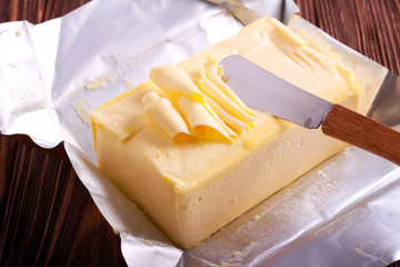 Butter over paper package