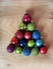 colorful Christmas balls stacked in triangle shape