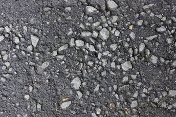 stone and asphalt texture background. rubble stones with asphalt for sidewalks. black background
