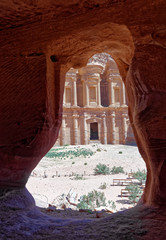 View through the rock window of a storage room in Petra to the monastery Al-deir