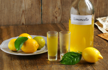 Limoncello homemade on wooden tableI, italian alcoholic beverage
