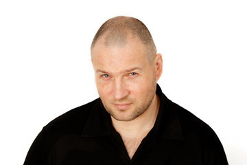 Obraz premium Portrait of a gloomy shaven young men, suspicious emotion concept