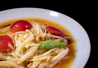 Spicy Thai Papaya Salad in the white plate
