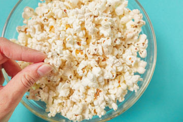 popcorn on color background