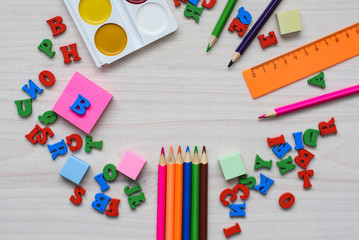 School and office tools for drawing on a wooden background