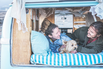 Happy couple camping during alternative vacation