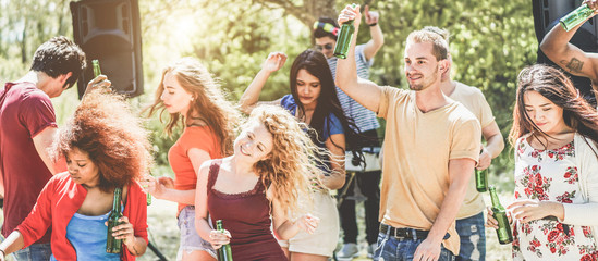 Young people dancing in summer party outdoor on nature