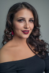 Obraz premium Portrait of a charming multi-ethnic girl with a chic smile