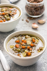 Italian lentil spinach soup. Selective focus, space for text. 
