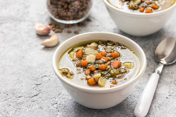 Instant pot golden lentil spinach soup. Selective focus, space for text. 