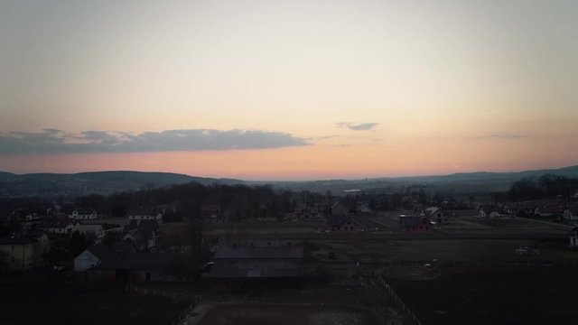 Drone shot of a typical Polish countryside. Sunset. Cinematic grading.