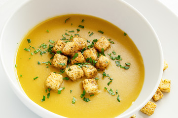 pea soup with croutons and chopped parsley