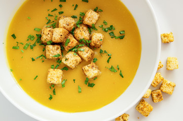 pea soup puree with fried in spices croutons and parsley 