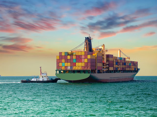 A tugs boat assist container vessel to be berthing at industrail port of thailand.