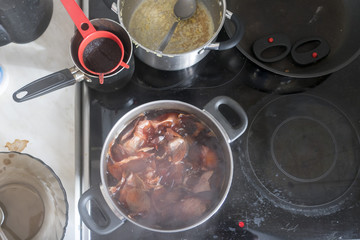 Clutter and dirt in the kitchen, unwashed pan and dirty stove