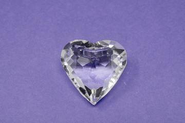 A glass diamond set against a brightly coloured background