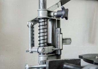Mechanism with a spring, press