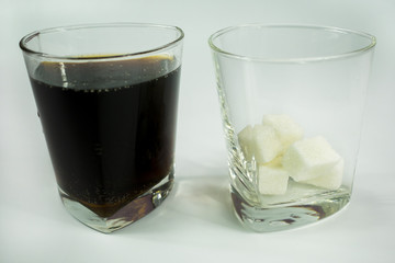 a glass of soda and sugar