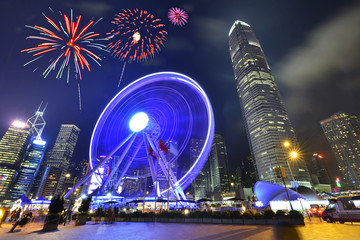Night view and fireworks at ferris Wheel in Hong Kong City.
