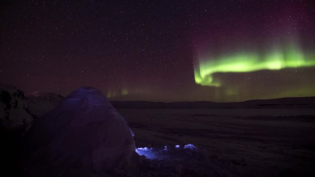 Aurora Borealis seen above Adam's Sound with an Iglu in the foreground.